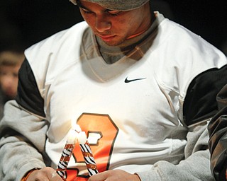 MADELYN P. HASTINGS | THE VINDICATOR..Sharon High School football player Troy Hejazi mourns the loss of football players Corey Swartz and Evan Gill during a candle light vigil at the stadium on November 10, 2013. ... - -30-..