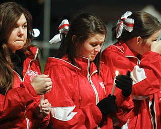 MADELYN P. HASTINGS | THE VINDICATOR..The Sharon High School cheerleaders mourn the loss of football players Corey Swartz and Evan Gill during a candle light vigil at the stadium on November 10, 2013. ... - -30-..