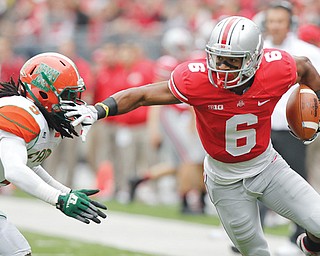 Ohio State wide receiver Evan Spencer (6) avoids a Florida A&M defender during a game in Columbus. Ohio State might be No. 3 in the polls, but Spencer thinks the Buckeyes are better than No. 1 Alabama and No. 2 Florida State.