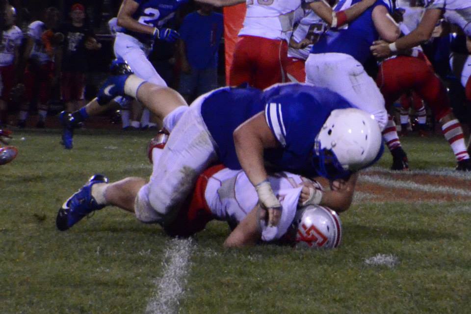 Western Reserve Lineman #68 Matt Mace tackles Cuyahoga Heights