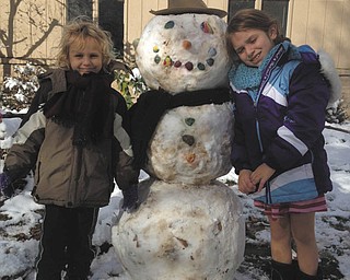 SPECIAL TO THE VINDICATOR
Joey Lettieri, 5, and Isabella Lettieri, 9, of Cape Hatteras, in the Outer Banks of North Carolina, were visiting Grandma Joanne Shutrump in Boardman this week when they got a blast of Northeast Ohio winter weather. Of course, the kids’ very first snowman had to be a work of art, right down to the hat and scarf that give him a distinctly cool fashion air. In the spirit of the best of both worlds, the flaky character they dubbed Chester has a face made with seashells from the seashore. The children’s parents are Maryjill (Shutrump) and John Lettieri.