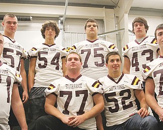 South Range defensive linemen, front, from left, Ben Farmer (71) Evan Schaefer (77), Zach Baird (52) and Garrett Sorley (79) and, in back, Ryan Haynes (57), Ben Baird (54), Jake Ruiz (75) and Adam Witmer (43) will be charged with controlling the ground game during the Raiders’ Week 2 Division VI playoff game Friday against Mogadore at Dr. Robert H. Hines Stadium in Minerva. Kickoff will be at 7:30 p.m.
