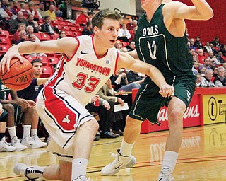 Youngstown State’s Ryan Weber drives around Warren Wilson’s Tyler Triplett during the Penguins’ home opener Thursday at YSU’s Beeghly Center. YSU downed the Owls, 104-58, to remain undefeated at 4-0.
