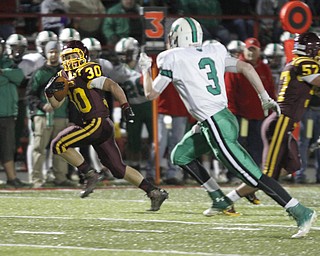 . ROBERT K. YOSAY | THE VINDICATOR...#30 SR Joe Alessi takes one last look back at Mogadore defender #3 Brendon Schrock as he scampers for his longest yardage of the night and a touchdown in the second quarter of ..South Range and Mogadore in Minerva Ohio .....-30-