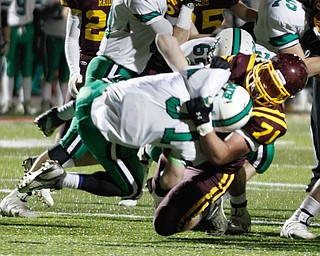 . ROBERT K. YOSAY | THE VINDICATOR..BIG HIT at the line as SR #71 Ben Farmer Wraps up and tackles Mogadore #31 Brandon Berry at the line during first quarter action..South Range and Mogadore in Minerva Ohio .....-30-