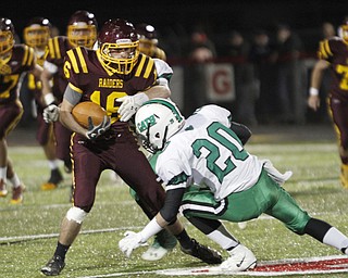 . ROBERT K. YOSAY | THE VINDICATOR..South Range #16 Zach Thorpe meets Mogadore #20 Alec Tarter as he is brought down during first quarter action and a 6 yard gain..South Range and Mogadore in Minerva Ohio .....-30-