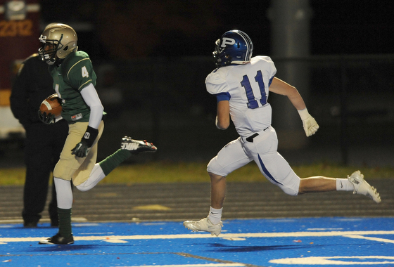 St. Vincent - St. Mary #4 Jarel Woolridge sprints to the end zone to score a touchdown beating Poland #11 Dylan Garver on a reverse on the first series of the game during Friday nights game in Ravenna.
