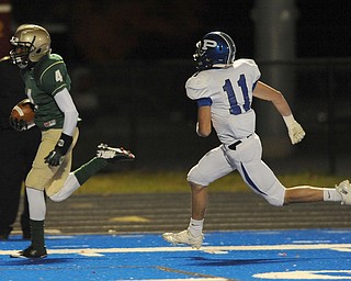 St. Vincent - St. Mary #4 Jarel Woolridge sprints to the end zone to score a touchdown beating Poland #11 Dylan Garver on a reverse on the first series of the game during Friday nights game in Ravenna.