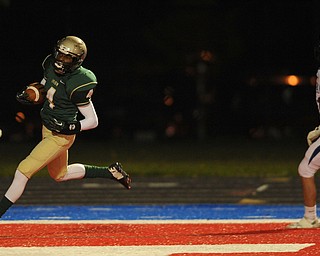 St. Vincent - St. Mary #4 Jarel Woolridge sprints to the end zone to score a touchdown beating Poland #11 Dylan Garver on a reverse on the first series of the game during Friday nights game in Ravenna.