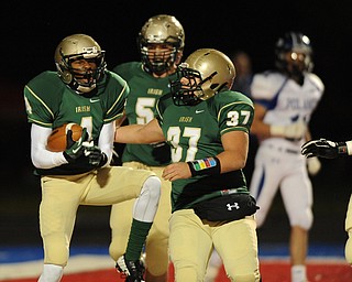 St. Vincent - St. Mary #4 Jarel Woolridge celebrates with teammate #37 Joe Faetanini and #51 Alec Bianci after scoring a touchdown on the first series of the game during Friday nights game in Ravenna. Poland #11 Dylan Garver pictured.