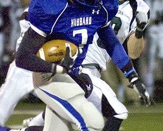 Kelli Cardinal/The Vindicator .Hubbard running back Larry Scott carries the ball Friday night past an Aurora defender at Falcon Field in Austintown.