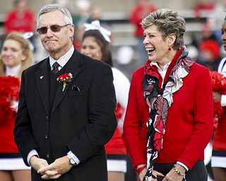 MADELYN P. HASTINGS | THE VINDICATOR..Ellen Tressel smiles with her husband Jim after being inducted into YSU's Hall of Fame at half time of the YSU vs. NDSU game at Stambaugh Stadium on November 16, 2013.... - -30-..