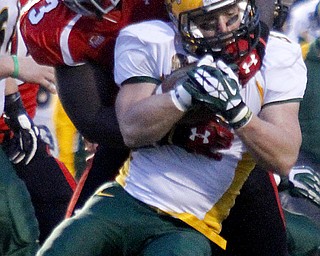 MADELYN P. HASTINGS | THE VINDICATOR..YSU's Emmanuel Kromah (93) tackles NDSU's Derrick Lang (5) during their game at Stambaugh Stadium on November 16, 2013. The Penguins lost to Bisons 17-35..... - -30-..