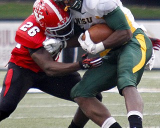 MADELYN P. HASTINGS | THE VINDICATOR..YSU's Jameel Smith (26) tackles NDSU's Sam Ojuri (22) during their game at Stambaugh Stadium on November 16, 2013. The Penguins lost to Bisons 17-35.... - -30-..