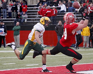 MADELYN P. HASTINGS | THE VINDICATOR..YSU's Nate Adams (44) catches the ball and scores a touchdown while NDSU's Christian Dudzik (35) follows behind during their game at Stambaugh Stadium on November 16, 2013. The Penguins lost to Bisons 17-35..... - -30-..
