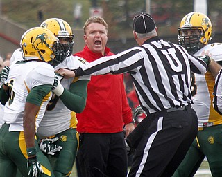 MADELYN P. HASTINGS | THE VINDICATOR..YSU's head coach Eric Wolford yells at a referee during their game against NDSU at Stambaugh Stadium on November 16, 2013. The Penguins lost to Bisons 17-35... - -30-..