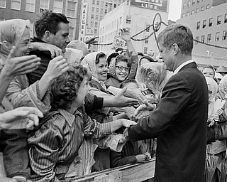 President John F. Kennedy is greeted by an enthusiastic crowd in front of the Hotel Texas in Fort Worth,  Nov. 22, 1963. 