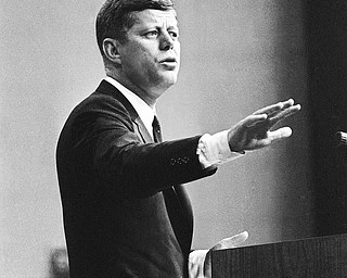 President John F. Kennedy answers a question during his news conference in Washington on Sept. 13, 1962. Much of the session with reporters was devoted to a discussion of the Cuban situation.