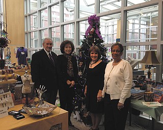 SPECIAL TO THE VINDICATOR
Members of An American Holiday preview party committee meet in the gift shop of the Butler Institute of American Art, near the volunteers tree. From left to right are Anthony Monaco, Florence Wang and docents Cynthia Perantoni Anderson, chairwoman; and JoAnn Blunt. Ornaments on the tree were designed by Butler gift shop volunteers.
