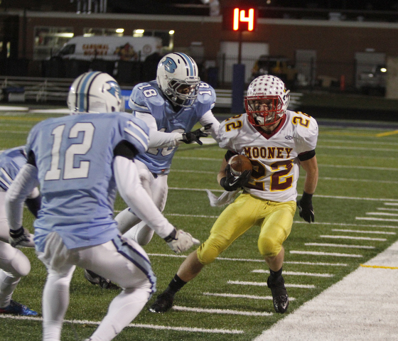  .          ROBERT  K. YOSAY | THE VINDICATOR..No where to go as Mooneys Mark Handel gets surrounded after he made the first down by #12 Dom Berdysz and  #18 Davell Moore-Meeks of Benedictine..Cardinal Mooney Cardinals vs Cleveland Benedictine Bengals in Solon.....-30-