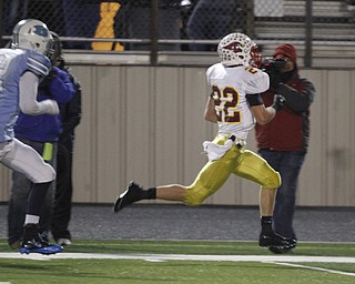  .          ROBERT  K. YOSAY | THE VINDICATOR..Foot race to the EndZone as Mooney #22 Mark Handel breaks free for a 60+ yard TD Run and he start of a mooney first half that saw 28 points - in the chase is  @@ Benedictine Matt Merimee (first quarter action)..Cardinal Mooney Cardinals vs Cleveland Benedictine Bengals in Solon.....-30-