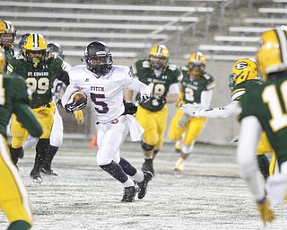  .          ROBERT  K. YOSAY | THE VINDICATOR..Fitchs #5 Andrew Dowell  looks for a place to run as he is surrounded by  St Eds #14 Matt Carandang  Max Williams  (99) #26 (hidden) Kyle Hefedus and #18  David Dowell.. Austintown Fitch and St Edwards at Infocision in Akron.....-30-