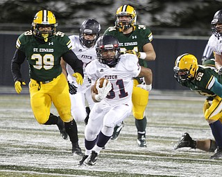  .          ROBERT  K. YOSAY | THE VINDICATOR..Fitchs #31  Tyler Hewlett  is off for a first down as St eds 39  Ralph Nichols  #34  Jack Schroeder and  #52   Austintown Fitch and St Edwards at Infocision in Akron.....-30-