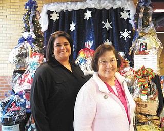 SPECIAL TO THE VINDICATOR: Preparations are being made for the Ursuline Preschool and Kindergarten’s 25th annual Once Upon a Christmas craft show Dec. 7. Above are craft show chairwoman Christy Durham, left, and Sister Charlotte Italiano, school principal.