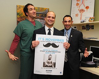 Surgical assistant Andrew Labedz, left, Dr. Dan Ricchiuti, and Jonathon Fauvie celebrated the beginning of Movember at the Boardman office of NEO Urology.