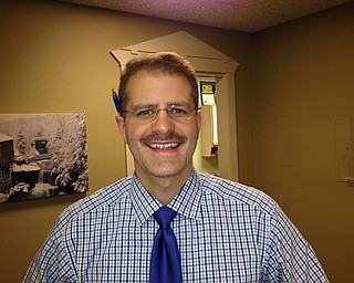 Dr. Mark Memo D.O., a urologist and surgeon, displayed his mid-Movember facial hair.