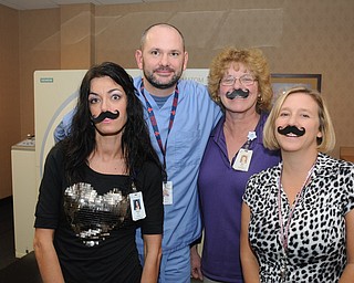 Supporters of Movember from the  oncology department staff at St. Elizabeth Hospital wore fake mustaches for the cause.