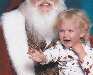 Mena Monroe, 3, was not a happy girl when it was her time to meet Santa. She is the granddaughter of Russ and Ellen Monroe of Austintown.