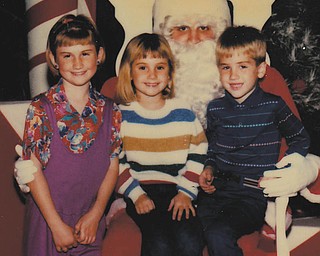 This joint encounter with Santa occurred 26 years ago for the Walcott siblings. Tricia (Walcott) Lenhart was 9 years old. She lives in Boardman with her husband, Scott, and children, Eric, 7, and Samantha, 5. Michael was 6 years old. He lives in Fort Lauderdale, Fla., and is engaged to be married in the spring to Jennifer Usas. Jessica (Walcott) Krauser was 5 years old. She lives in Columbus with her husband, Derek, and four-year-old twins, Ben and Kate. The picture was submitted by their parents, Bill and Debbie Walcott.