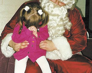 Pat Shively of New Middletown shared one of her favorite pictures of her granddaughter, Elizabeth Thompson of New Middletown, who is now 16 and a junior at Springfield High School.  Pat had taken her to the Mineral Ridge High School Frostie Frolics show in December 1998. As you can see, Elizabeth was less than thrilled to meet the big guy!