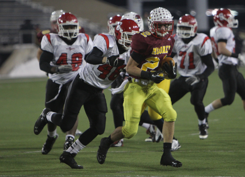 Cardinal Mooney's Mark Handel (22) runs through the Steubenville defense with Branden Jones (46) on his heels during the second half of Friday nights Division four Semi- Finals at Fawcett Stadium in Canton.  Handel rushed 14 times for 52 yards during the Cardinals 37-7 victory over Big Red.    Dustin Livesay  |  The Vindicator  11/29/30  Fawcett Stadium, Canton Ohio.