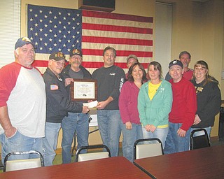 SPECIAL TO THE VINDICATOR
Lake Post 737 Legion Riders visited Jefferson Eagles Aerie 3881 Nov. 14 to accept a donation of $525 for the American Legion Legacy Scholarship Fund. A plaque was presented for their donation. The Riders have collected over $6,433 this year and total contributions since 2007 are $30,430. The scholarship fund provides aid for children who lost a parent since Sept. 11, 2001, in service to our country. Above, from left, are Brian Hall, Jefferson Eagles Aerie 3881, president; John Chittock, American Legion Rider Post 737 chaplain; Rick Cadle, American Legion director; and Tom O’Mears, Jefferson Eagles trustee. On the far right is Bud Bittinger, American Legion Rider road captain. The rest are members of Jefferson Eagles Aerie. 