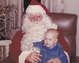 Judy Nuth sent this picture of her daughter Loani, who is now 51. Santa was Judy's father, Valentine Lehnerd.