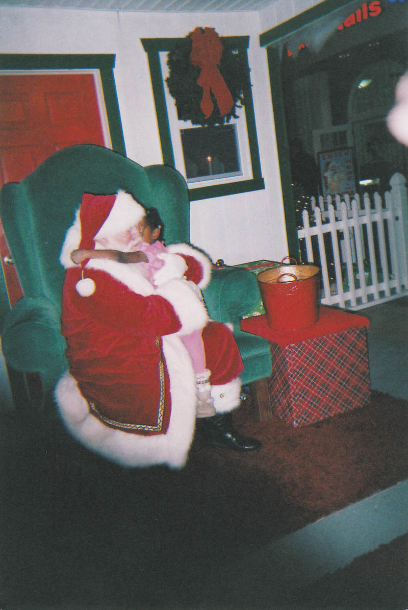 Santa gets a hug from Leilani Pete, age 5. Sent by grandmother Othella May.