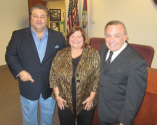 Trumbull County commissioners Dan Polivka, left, and Frank Fuda, right, along with commissioners’ clerk Paulette Godfrey are among 30 county employees taking part in the 16-week Lose and Win program in which they will exercise and receive counseling on nutrition.