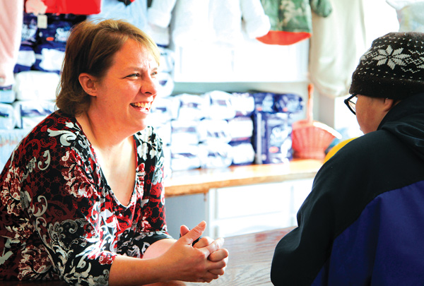 Melanie Rauschenbach, owner of Kid’s Stuff in Struthers, talks with the son of a customer, Cody Straley, 14. The children’s resale shop recently moved from State Street to Lowellville Road.