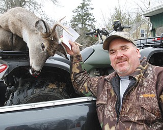 Pete D’Amico of Garrettsville checks in a six-point buck at Monty’s Mosquito Lake Carry Out in Mecca on
Monday, which was the first day of deer gun season in Ohio. Deer processing sites across the Valley saw a decrease in the number of hunters who brought deer to be checked, instead choosing to do so online.