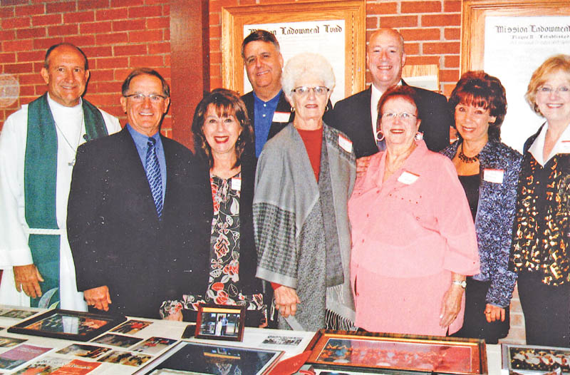 SPECIAL TO THE VINDICATOR
Trumbull Senior Production Co. recently received an award of $1,200 from the endowment fund of Living Lord Lutheran Church in Howland, presented by Dr. Richard Baringer, chairman of the fund. In front, from left, are the Rev. William D. Leitch; Dr. Baringer; Beckey Noftsinger, TSPC board member; Jean Bolinger, TSPC treasurer; Carol Bovee, TSPC vice president; Judy Mackey, TSPC secretary; and Jeannie Trask, TSPC board. In back are Joey Radza and Jason Burgermyer, TSPC president. TSPC presented its first $1,000 scholarship to an area high school graduate who will pursue a career in the performing arts in 2013.
