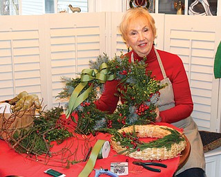 OSU Extension Master Gardener Volunteer Barb Delisio shows some of the supplies needed to use fresh greenery in the home.