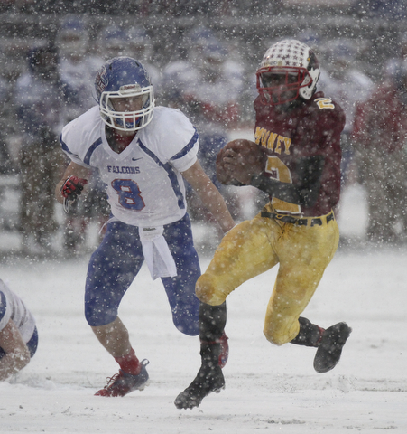 William D. Lewis The Vindicator Mooney's CJAmill(2) eludes Clinton's Zach Santoro(8).