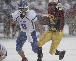 William D. Lewis The Vindicator Mooney's CJAmill(2) eludes Clinton's Zach Santoro(8).