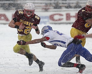 William D Lewis the Vindicator  Mooney's Mark Handel(22) eludes Clinton's Isaiah Stiverson(22).