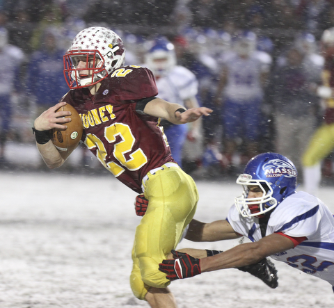 William D Lewis the Vindicator  Mooney's Mark Handel(22) eludes Clinton's Isaiah Stiverson(22).