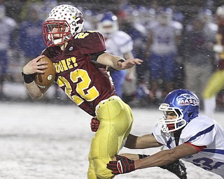 William D Lewis the Vindicator  Mooney's Mark Handel(22) eludes Clinton's Isaiah Stiverson(22).