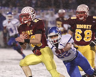 William D Lewis the Vindicator  Mooney's Mark Handel(22) eludes Clinton's Isaiah Stiverson(22).