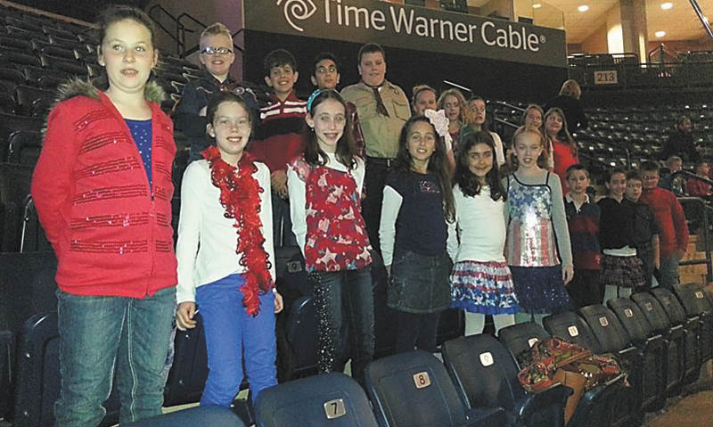 The Holy Family Youth Choir recently sang at a Phantoms hockey game at the Covelli Center. The choir sang the National Anthem and service songs in honor of Veterans Day. For information on how to join, contact Barb Zorn at zornbarb@aol.com. 
Special to The Vindicator
